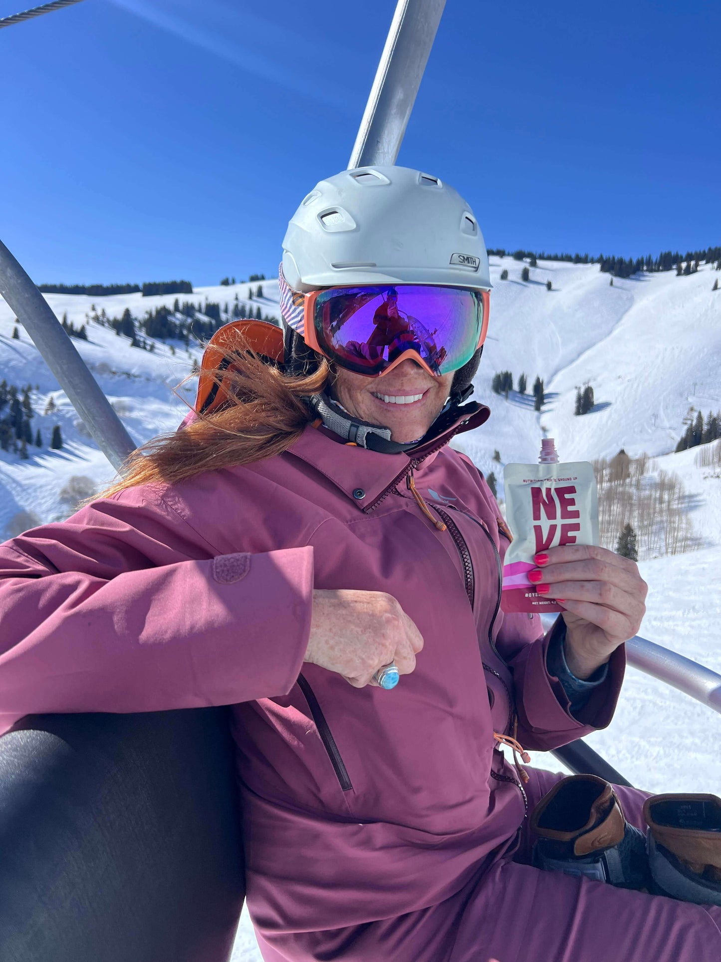 Vail local backcountry skier fueled by Neve Boysenberry Beet plant-based smoothie pouch — natural energy for ski touring athletes