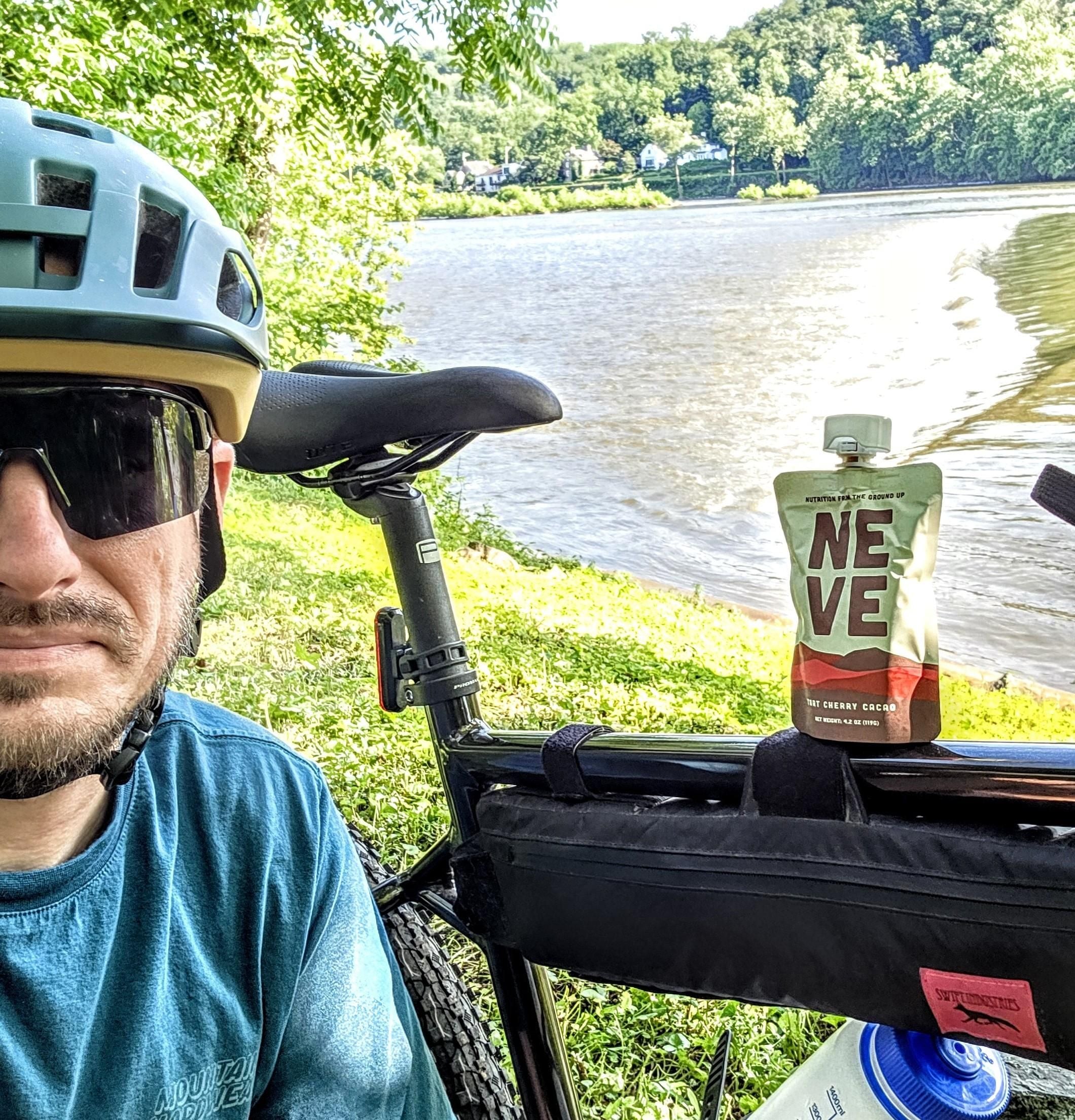 Tart Cherry Cacao recovery smoothie pouch on bike frame