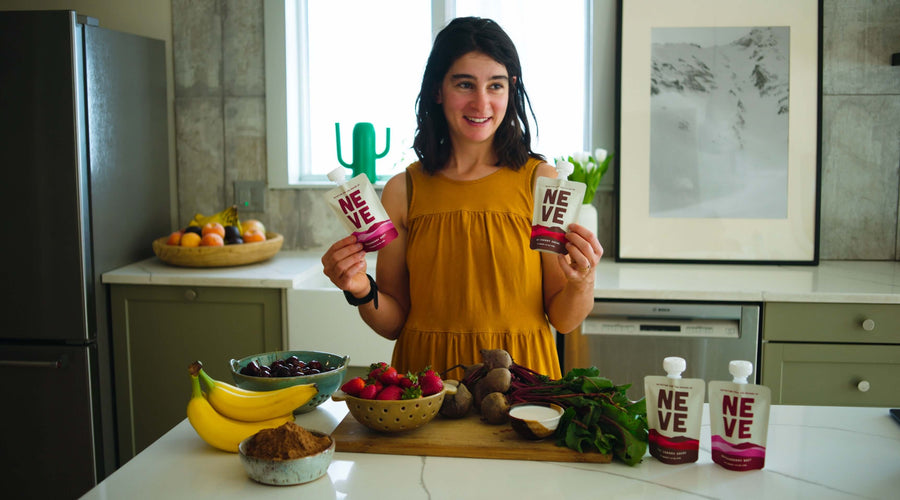 Nora holding two fuel pouches in her kitchen