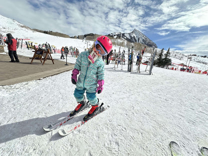 A little girl enjoys Neve's Boysenberry Beet while skiing.