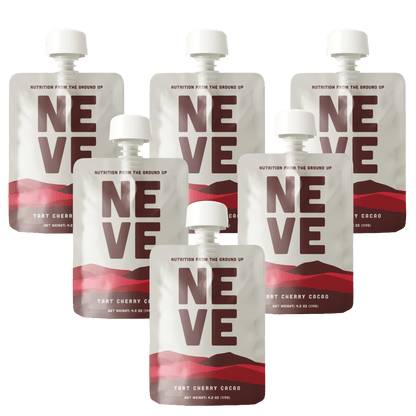Six Neve Tart Cherry Cacao smoothie pouches arranged in a scattered pattern on a transparent background.